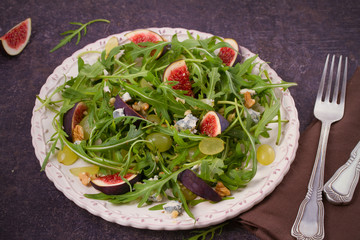 Grapes, figs, blue cheese, arugula and walnuts salad, horizontal