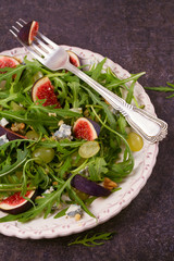 Grapes, figs, blue cheese, arugula and walnuts salad, vertical