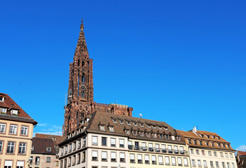 Fototapeta na wymiar Strasbourg Cathedral behind city-centre buildings - Strasbourg - France