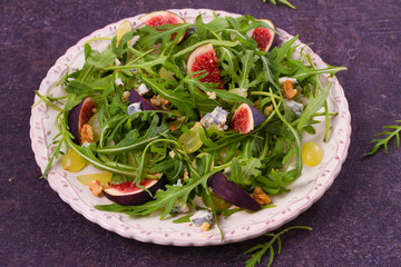 Grapes, figs, blue cheese, arugula and walnuts salad, horizontal