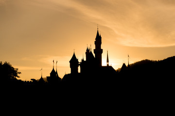 silhouette of castle with sunset sky.