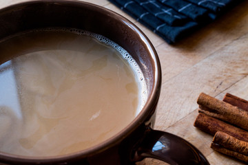 Masala Chai Tea in a big brown Cup.