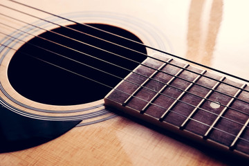 Obraz premium Close Up shot photo of Classic acoustic guitar with filter effect retro vintage style