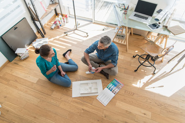 At the office two architects working on a construction project