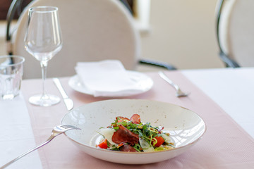 Green salad with Parma ham and Tomato. Sprinkle with parmesan cheese. Healthy food style - Processing Warm White balance. Healthy vegetables salad.