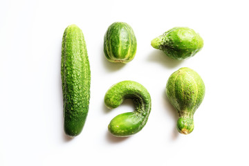 Different shape fresh cucumbers on white background