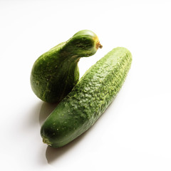 Different shape fresh cucumbers on white background