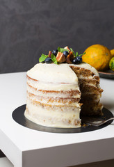 Pumpkin cake with cream cheese, berries, vertical, selective focus