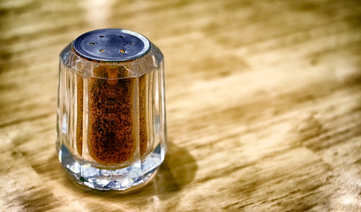 Glass Shaker Fully Filled with Dried Chilli Powder