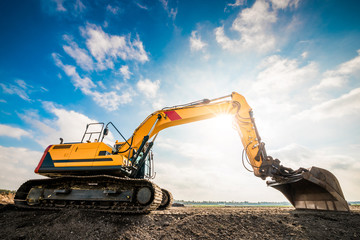 Big excavator in construction site