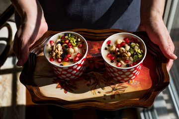 Turkish Traditional Dessert Ashure (Noah's Pudding) served with tray.