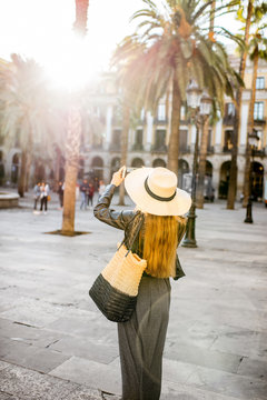 Young woman tourist walking on the reila square in Barcelona city