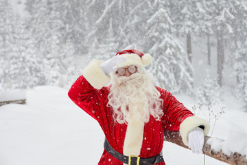 Santa Claus on snow in winter at Christmas.