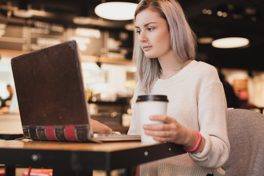Young girl working at a cafe