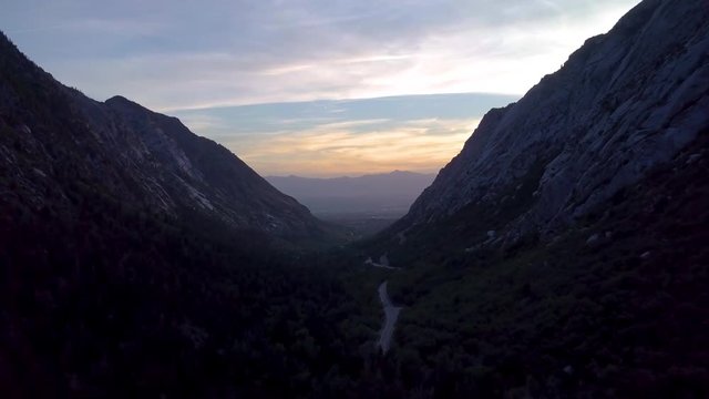 Aerial View, Flying Through Glacier Formed Little Cottonwood Canyon In Utah's Wasatch Mountain Range, View Of Salt Lake City And Ochre Mountains In Distance