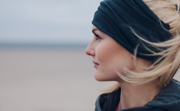 Close-up portrait of a focused female runner