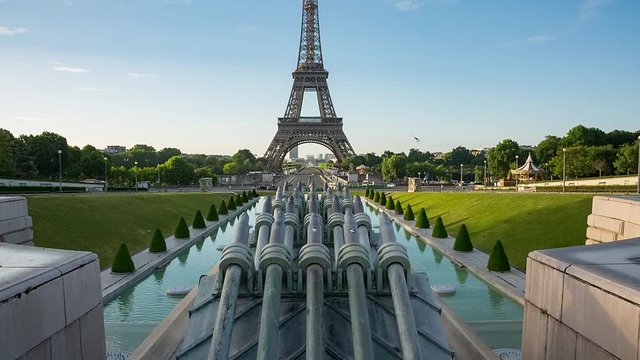 Eiffel Tower video from Trocadero Place on sunrise with fountains on foreground. Up tilting