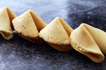Fortune Cookies on dark background. Chinese cookie with wisdom.