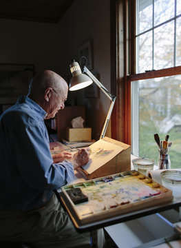 Senior Man Painting in Home Studio