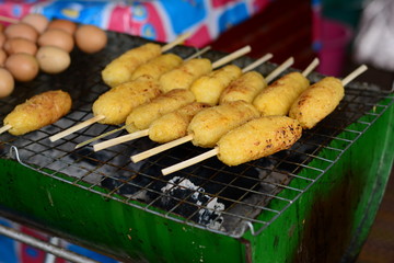 egg roast ,sticky rice roast ,traditional street food for sale in the local market of thailand