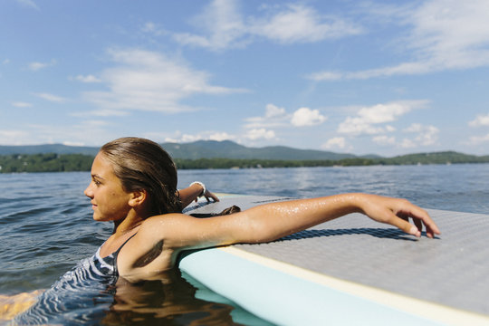 Girl Relaxing on Stand Up Paddle Board
