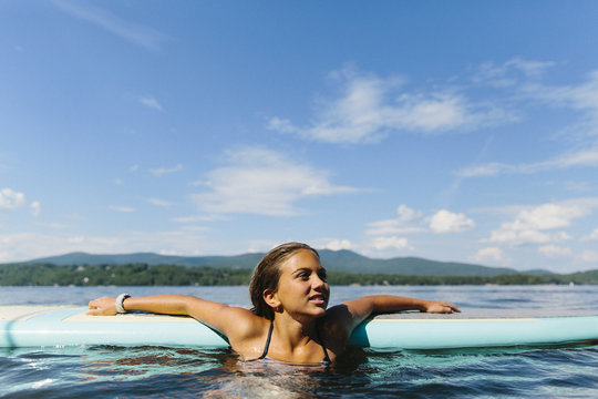 Girl Relaxing on Stand Up Paddle Board
