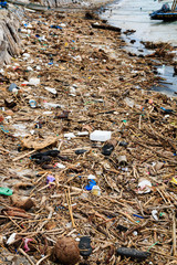 Pollution Problem - plastic, containers and other debris polluting the ocean and beach