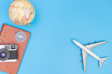 Plane toy and travel objects on blue background for travel concept