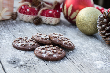 Cocoa cookies and spices on a wooden background near, Christmas decorations