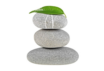 Fototapeta premium Spa stones and green leaf isolated on a white background