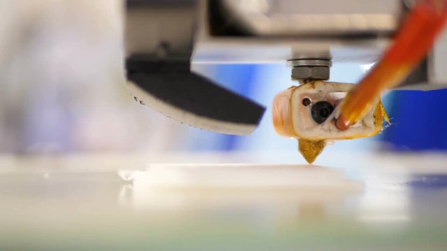 Working 3d printer sequence. Printing with Plastic Wire Filament on 3D Printer. 3D Printing is turning the impossible into the possible. Three dimensional printer during work in school laboratory