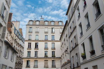 Paris, beautiful facades in Montmartre, charming typical building 
