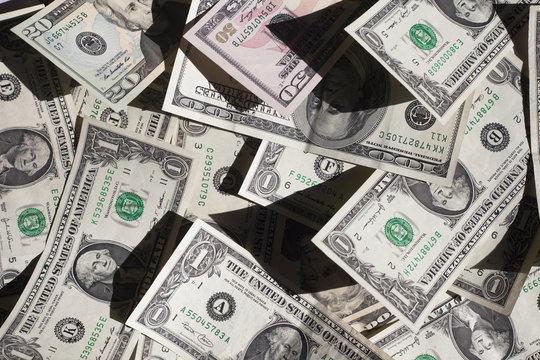 Overhead view of scattered American dollar bills