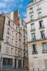 Paris, beautiful facades in Montmartre, charming typical building 
