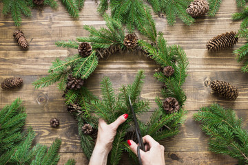 Making Christmas wreath using fresh and all natural materials.