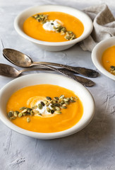 Squash soup on gray concrete background