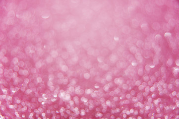 Pink bright abstract bokeh background. Sparkle texture for birthday card or wedding, valentine's day, party and other holidays invitation backdrop.