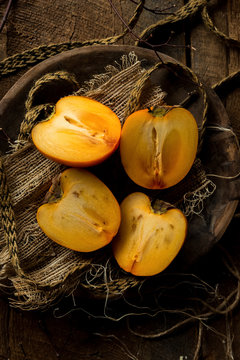 Sliced Persimmons in Rustic Setting