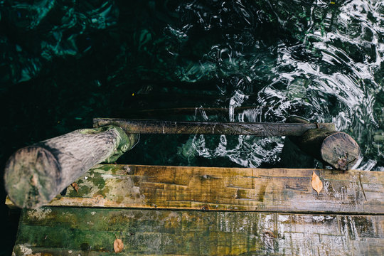 Wooden Ladder into crystal blue water