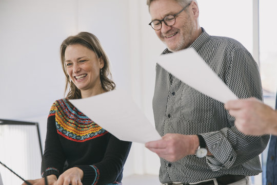 Three people practicing in a choir