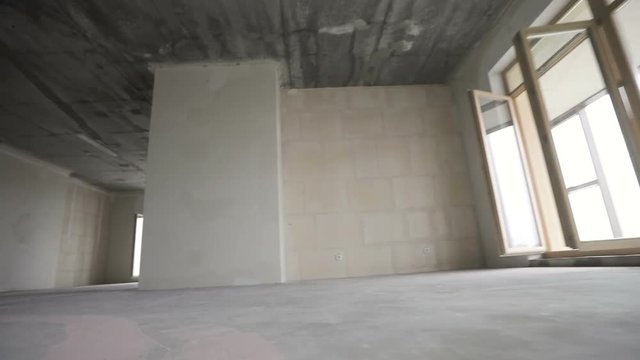 moving in new home. Overview of empty room with bare walls, ceiling, floor