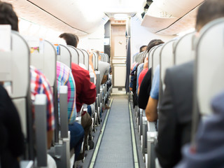 passengers traveling in passenger plane