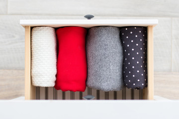 Fototapeta na wymiar warm clothes in the dresser