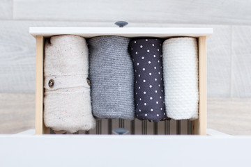 Fototapeta na wymiar warm clothes in the dresser
