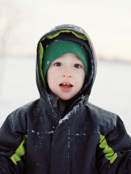 cute little boy dressed to play in the snow