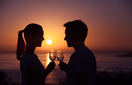 Romantic date by the sea with wine and sunset view