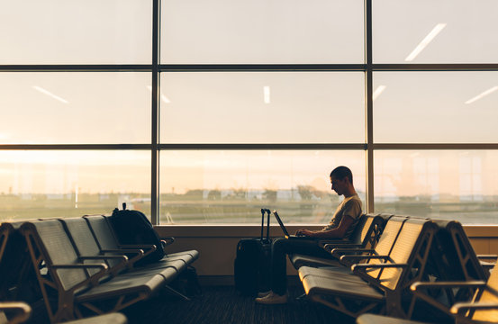 Man Waiting for His Flight on an Empty Gate