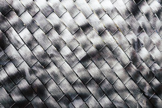 Metallic silver paint covering chain-link fence