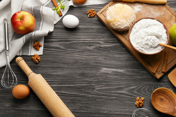Raw dough and ingredients on kitchen table