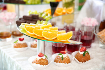 Table with desserts and drinks for wedding